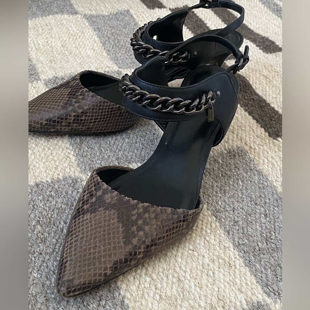 Coach, style: Garland. Snake skin/black sling back point toe heels